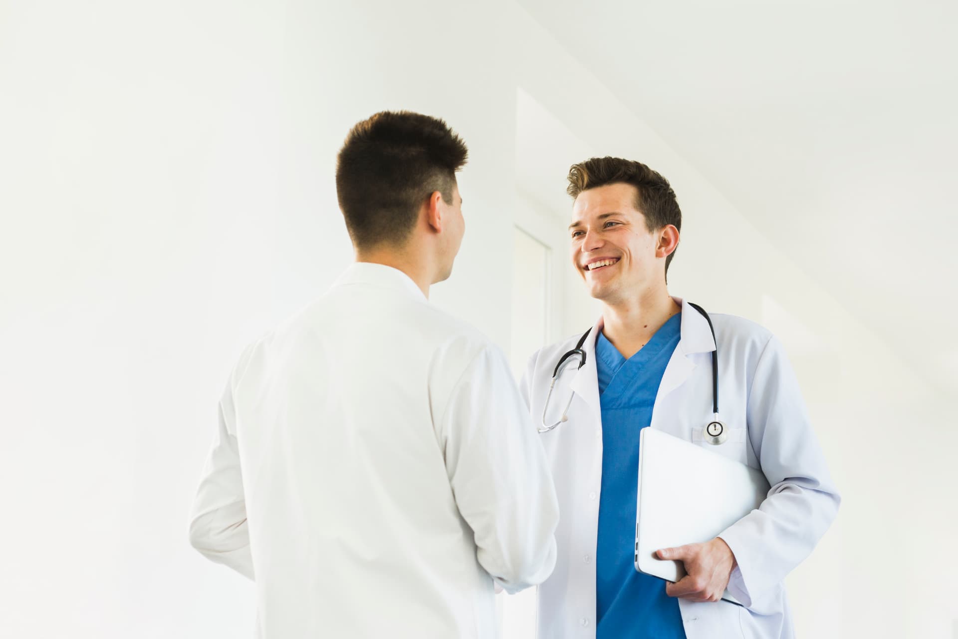 Client receiving aftercare guidance and products at a follow-up review